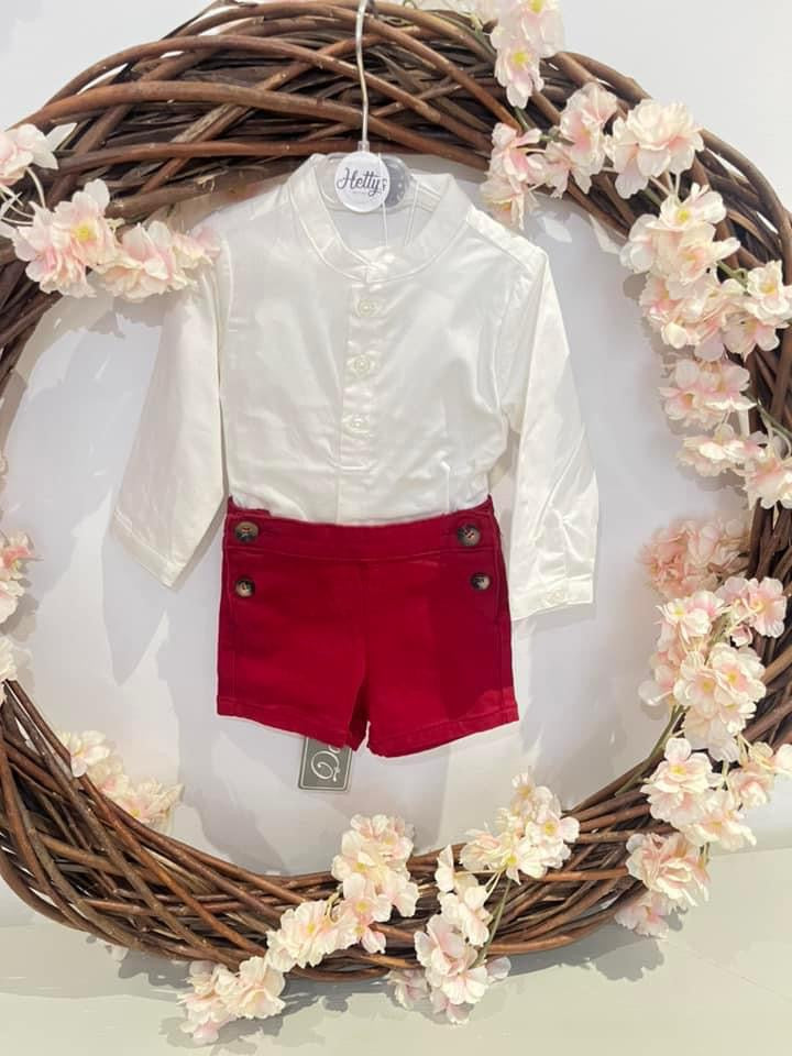 White shirt and red shorts